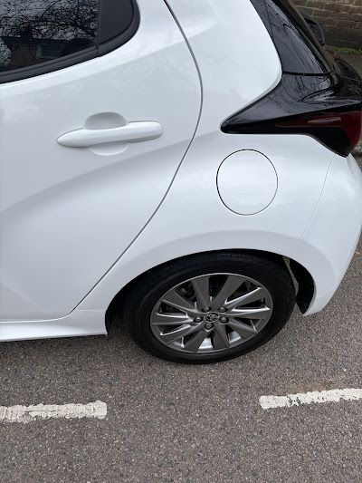 White Toyota door after full scratch repair and paint blend