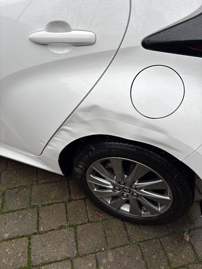 White Toyota deep door scratch before repair