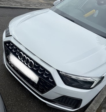White Audi bonnet after panel beating and paint match