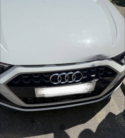White Audi bonnet dent before panel beating